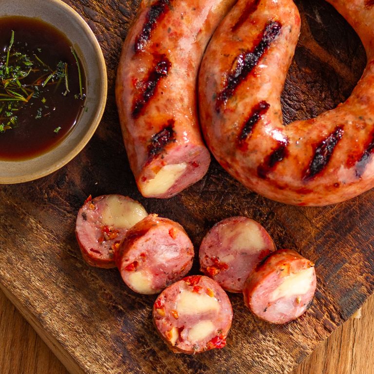LINGUIÇA DE PERNIL COM QUEIJO COALHO TOMATE SECO E MANJERICÃO 500G